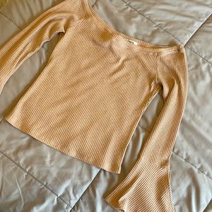 Pink top with flare sleeves; size medium but fits like a small!